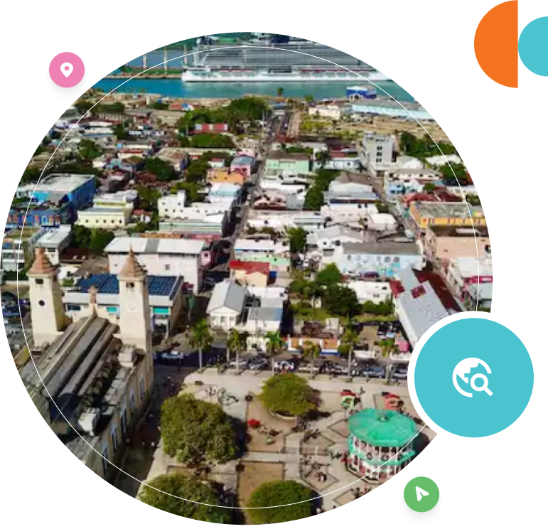 A bird 's eye view of the city with a cruise ship in the background.